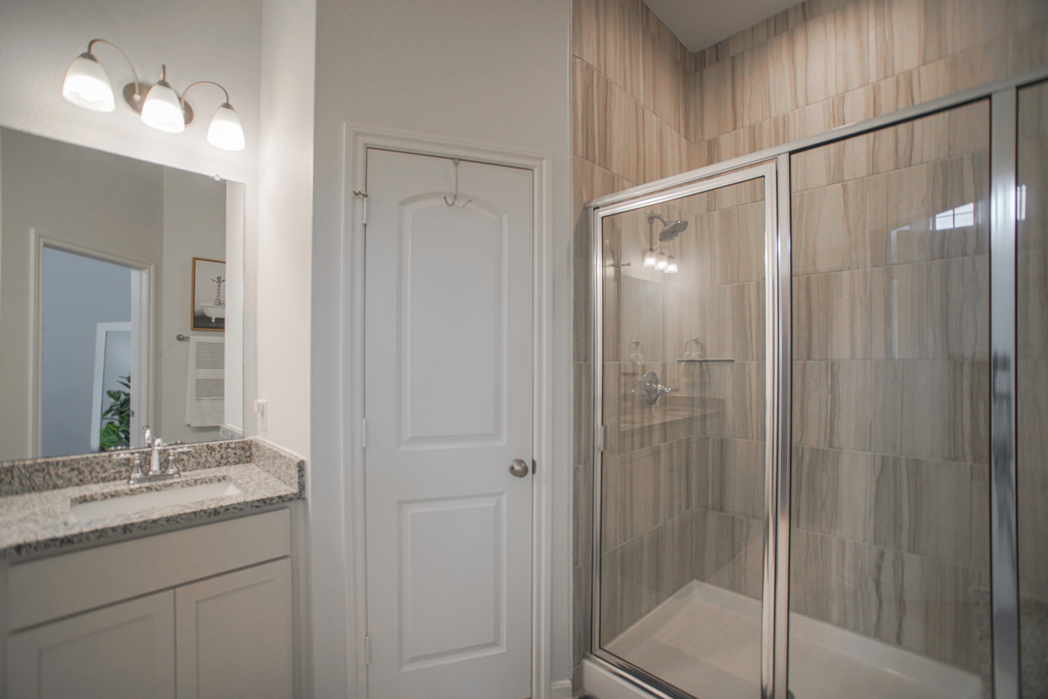 4232 Merry Mill Drive Spring, TX 77386 - Photo 30 of 50 Spa-like primary bath with double vanities, soaking tub, & separate shower for relaxation.