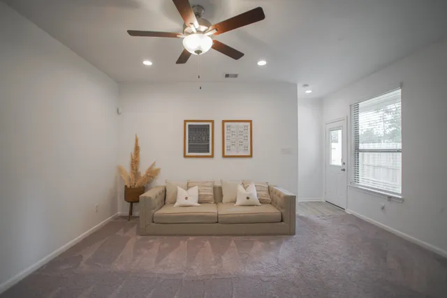a living room with furniture and a window