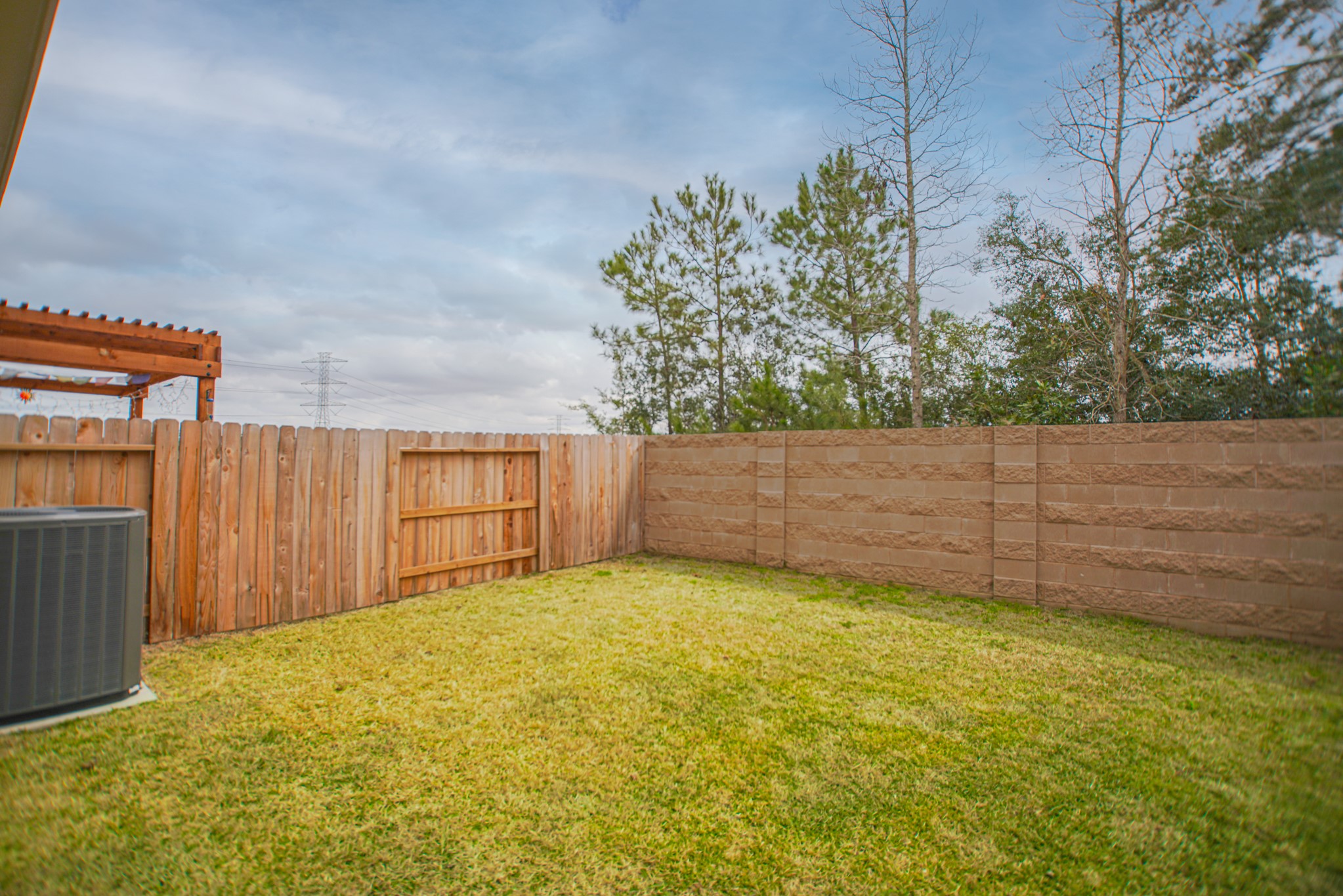 4232 Merry Mill Drive Spring, TX 77386 - Photo 50 of 50 Another backyard view showing mature greenery & peaceful surroundings.