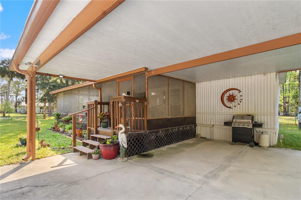 3650 176 Place Inglis, FL 34449 - Photo 11 of 52 a view of a chairs and tables in the patio
