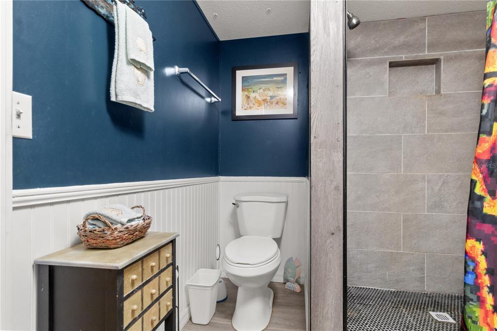 3650 176 Place Inglis, FL 34449 - Photo 24 of 52 a white toilet sitting next to a bathroom sink