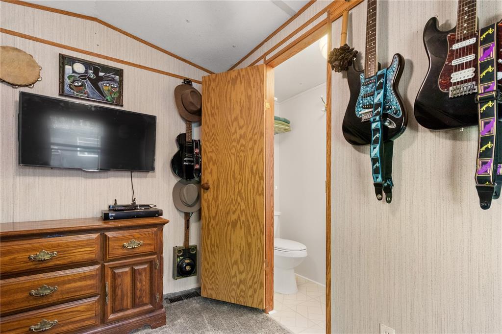 3650 176 Place Inglis, FL 34449 - Photo 30 of 52 a living room with furniture and a flat screen tv