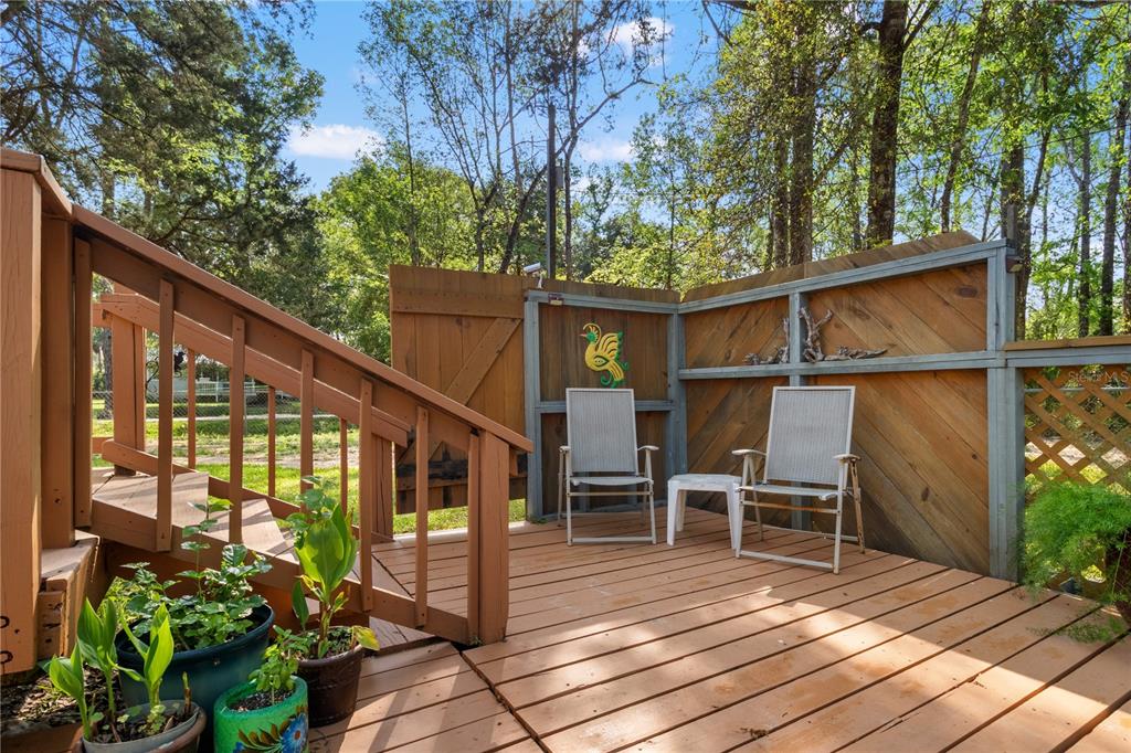 3650 176 Place Inglis, FL 34449 - Photo 33 of 52 a view of a chairs and table on the wooden deck