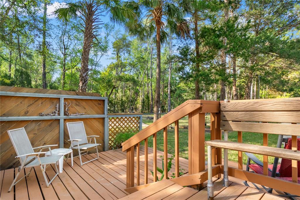 3650 176 Place Inglis, FL 34449 - Photo 34 of 52 a view of a balcony with chairs