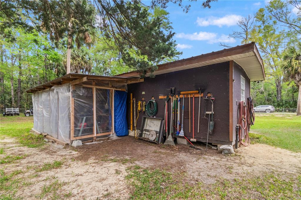 3650 176 Place Inglis, FL 34449 - Photo 38 of 52 a view of a wooden house with a large tree