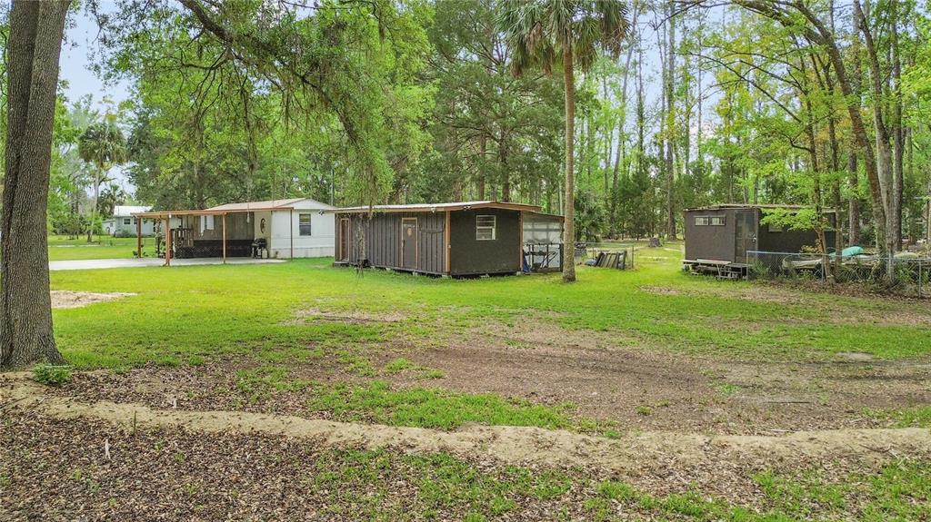 3650 176 Place Inglis, FL 34449 - Photo 9 of 52 a view of a house with backyard and sitting area
