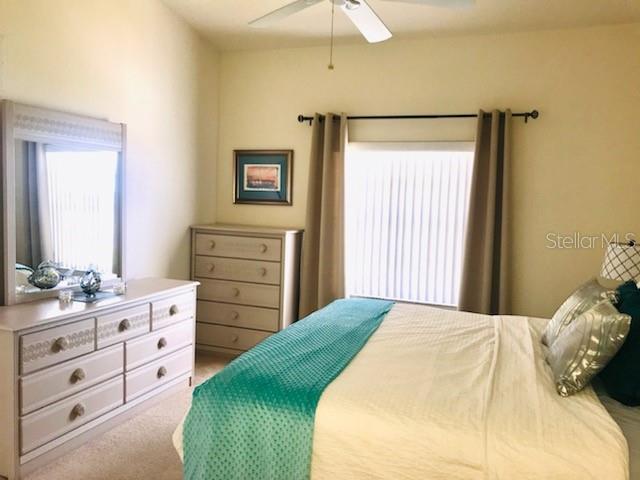 26397 Nadir Road, Unit 204 Punta Gorda, FL 33983 - Photo 11 of 26 a bedroom with a bed and a dresser