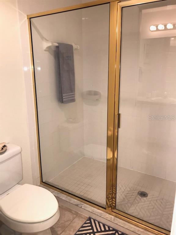 26397 Nadir Road, Unit 204 Punta Gorda, FL 33983 - Photo 13 of 26 a white toilet sitting next to a bathroom sink