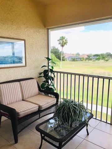 26397 Nadir Road, Unit 204 Punta Gorda, FL 33983 - Photo 17 of 26 a living room with furniture and a large window
