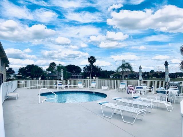 26397 Nadir Road, Unit 204 Punta Gorda, FL 33983 - Photo 20 of 26 a view of a lake with chairs