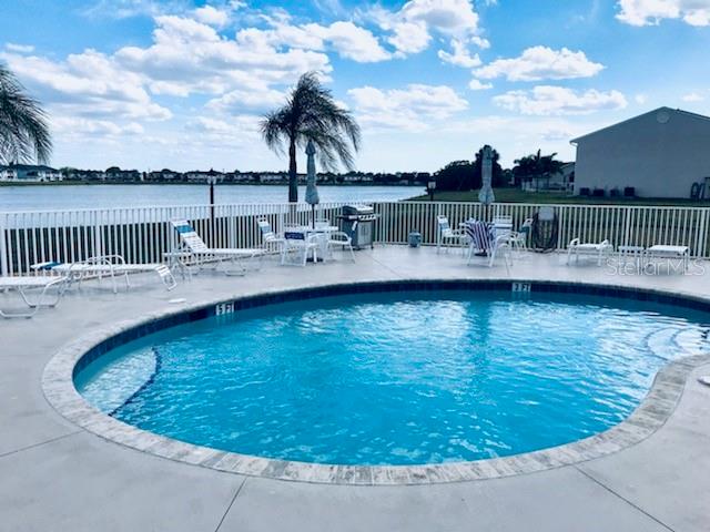 26397 Nadir Road, Unit 204 Punta Gorda, FL 33983 - Photo 21 of 26 a view of a swimming pool with a lake view