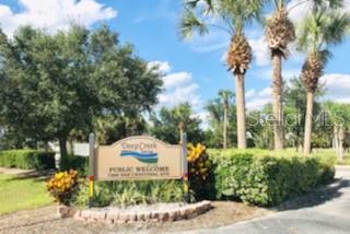 26397 Nadir Road, Unit 204 Punta Gorda, FL 33983 - Photo 23 of 26 a front view of a house with a garden