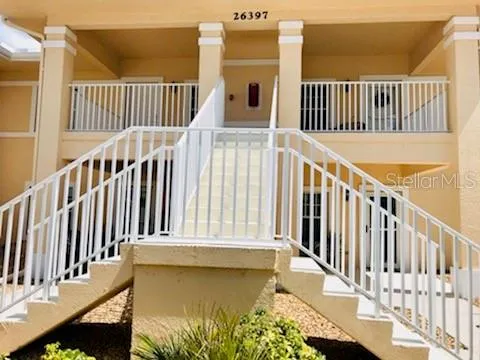 a view of a balcony with wooden floor