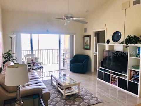 26397 Nadir Road, Unit 204 Punta Gorda, FL 33983 - Photo 6 of 26 a living room with furniture and a flat screen tv