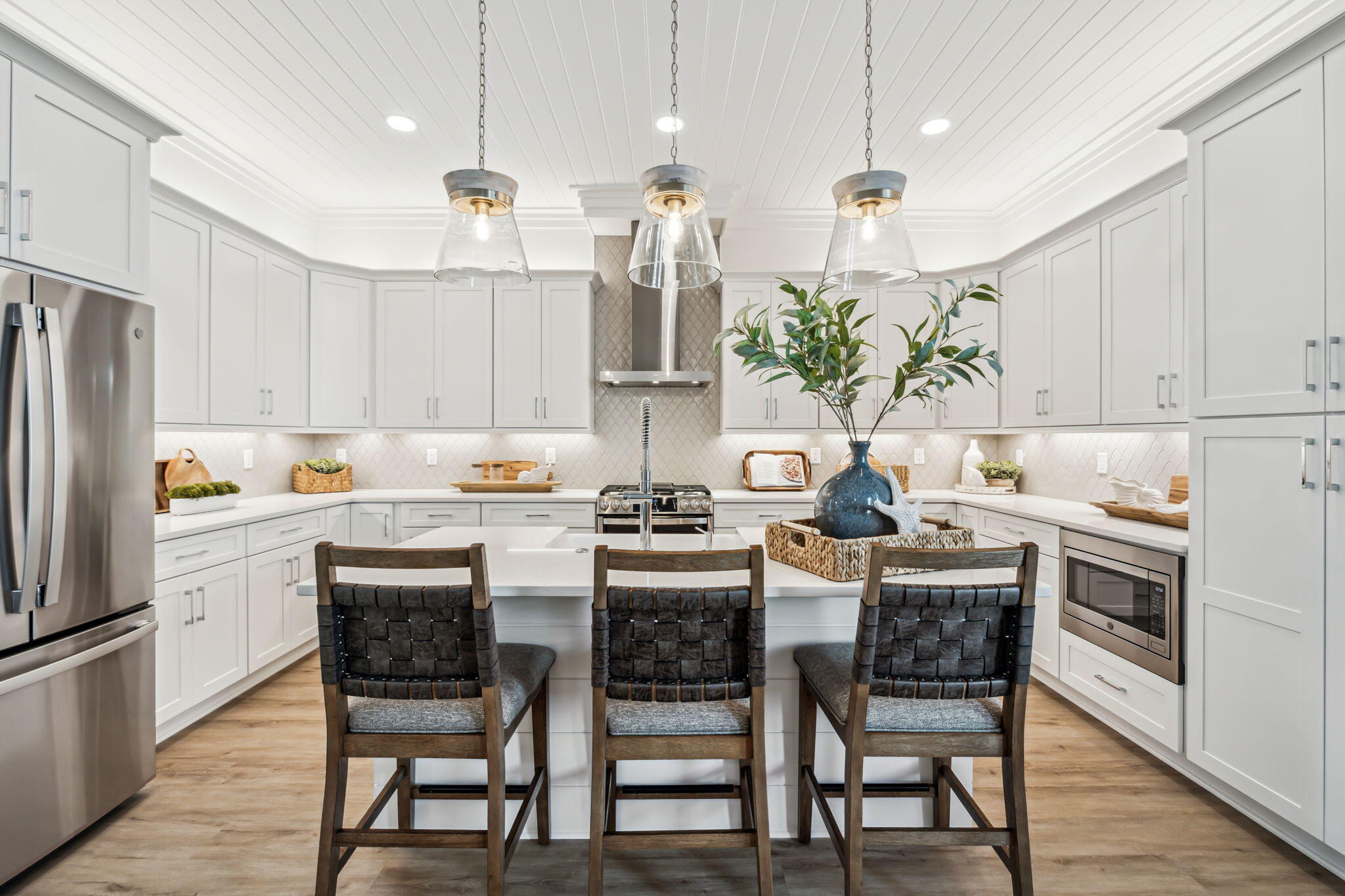 33 Grayton Boulevard Santa Rosa Beach, FL 32459 - Photo 10 of 48 a kitchen with kitchen island granite countertop a table and chairs in it