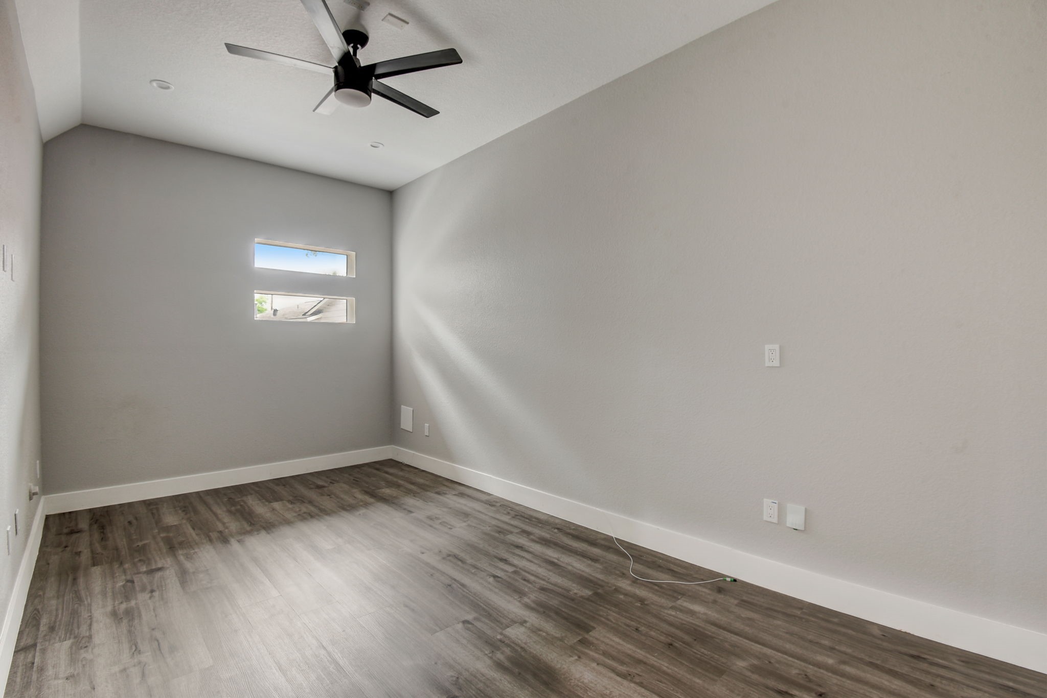 2507 Rogge Lane, Unit 2 Austin, TX 78723 - Photo 16 of 30 wooden floor in an empty room