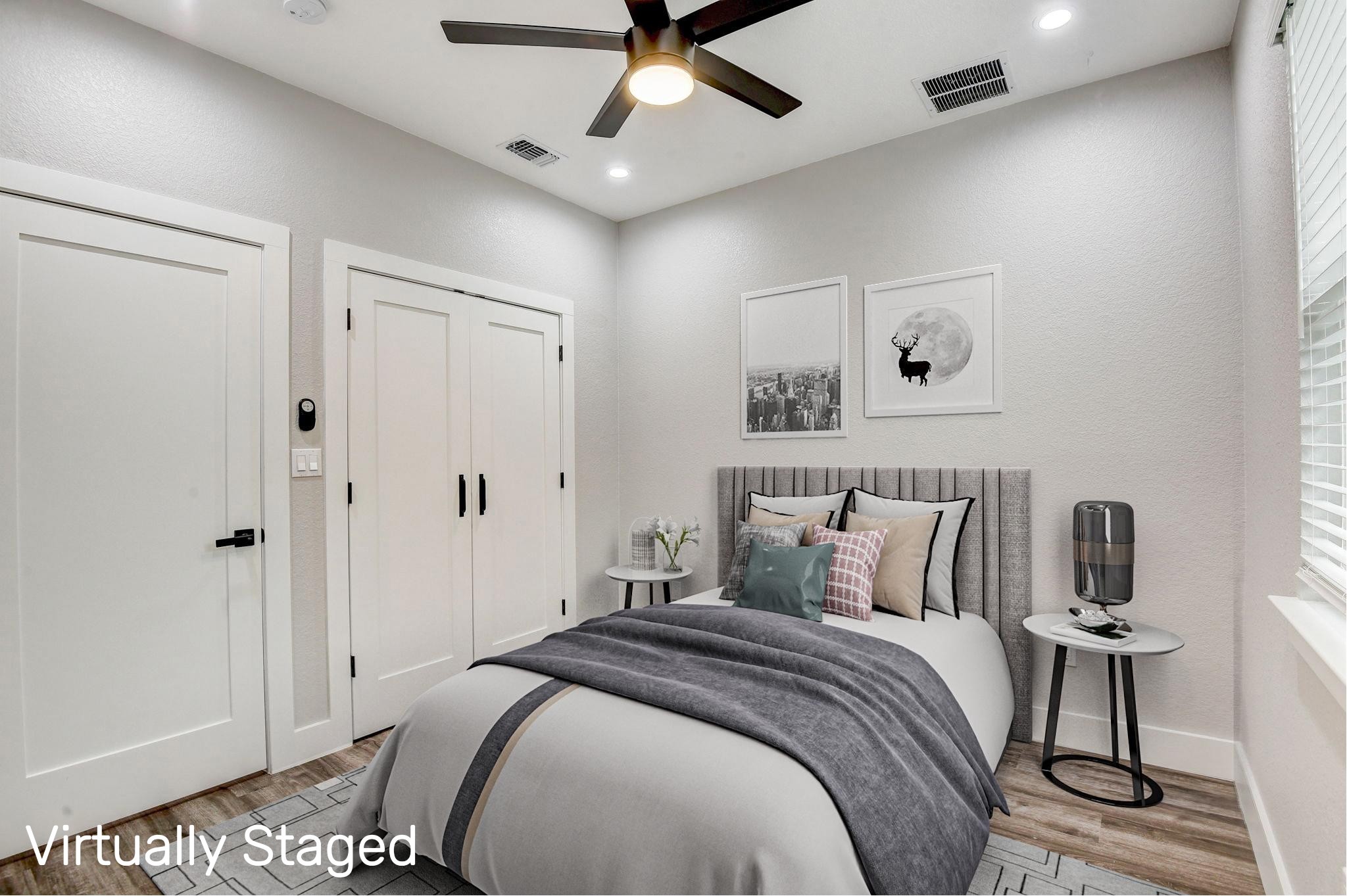 2507 Rogge Lane, Unit 2 Austin, TX 78723 - Photo 17 of 30 a bedroom with a bed and a ceiling fan