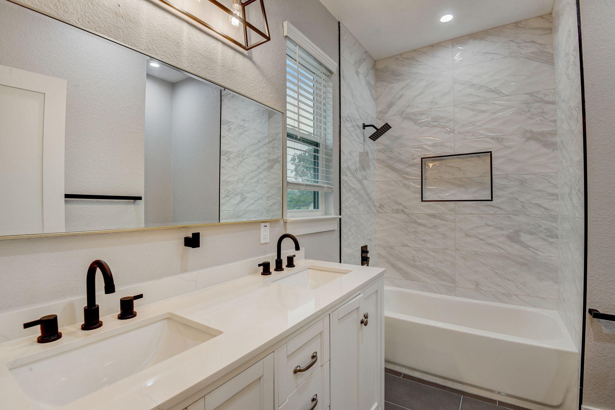 2507 Rogge Lane, Unit 2 Austin, TX 78723 - Photo 19 of 30 a bathroom with a sink and a bathtub
