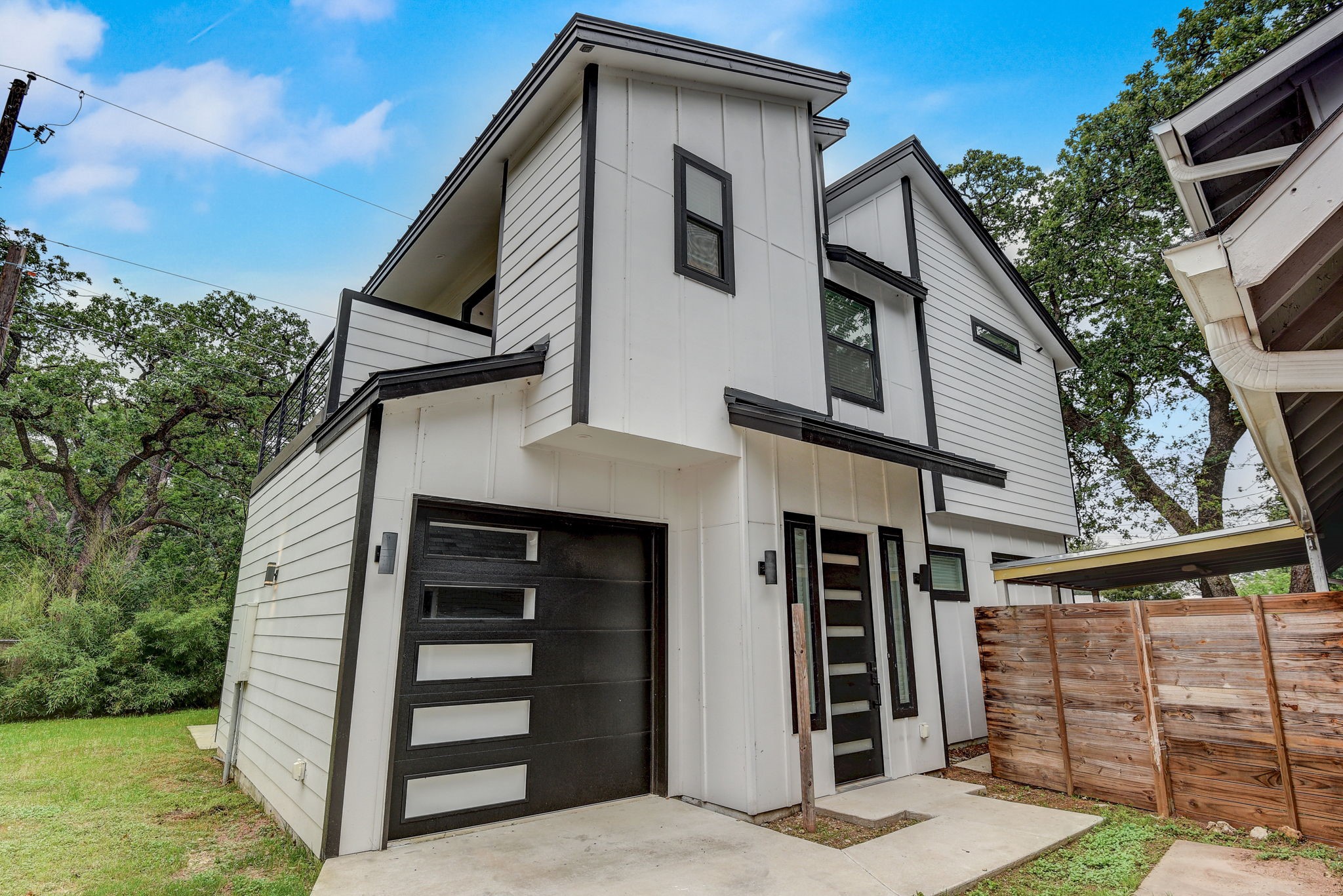 2507 Rogge Lane, Unit 2 Austin, TX 78723 - Photo 2 of 30 a view of a house with a door and a large window