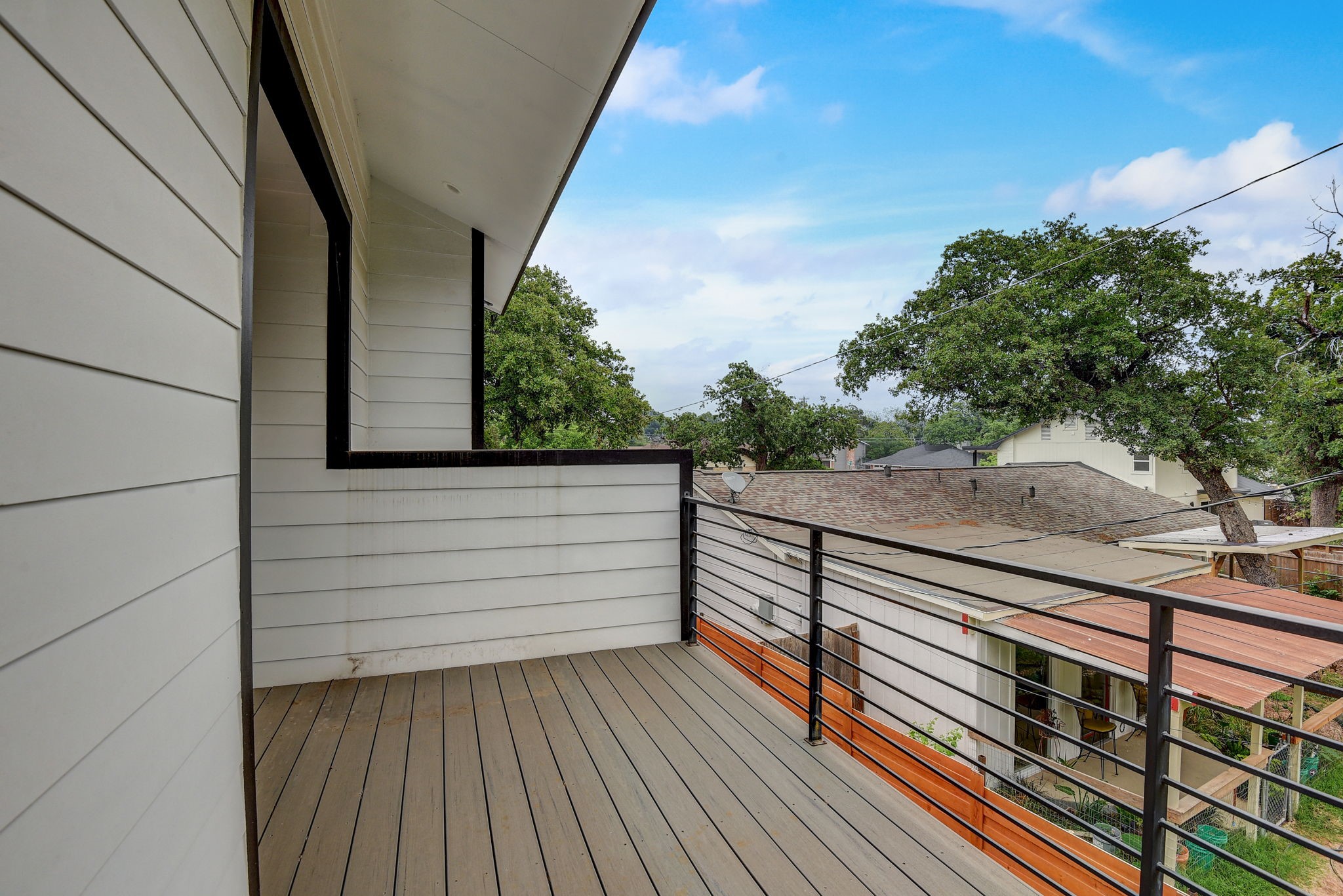 2507 Rogge Lane, Unit 2 Austin, TX 78723 - Photo 24 of 30 a view of a balcony with wooden floor and fence