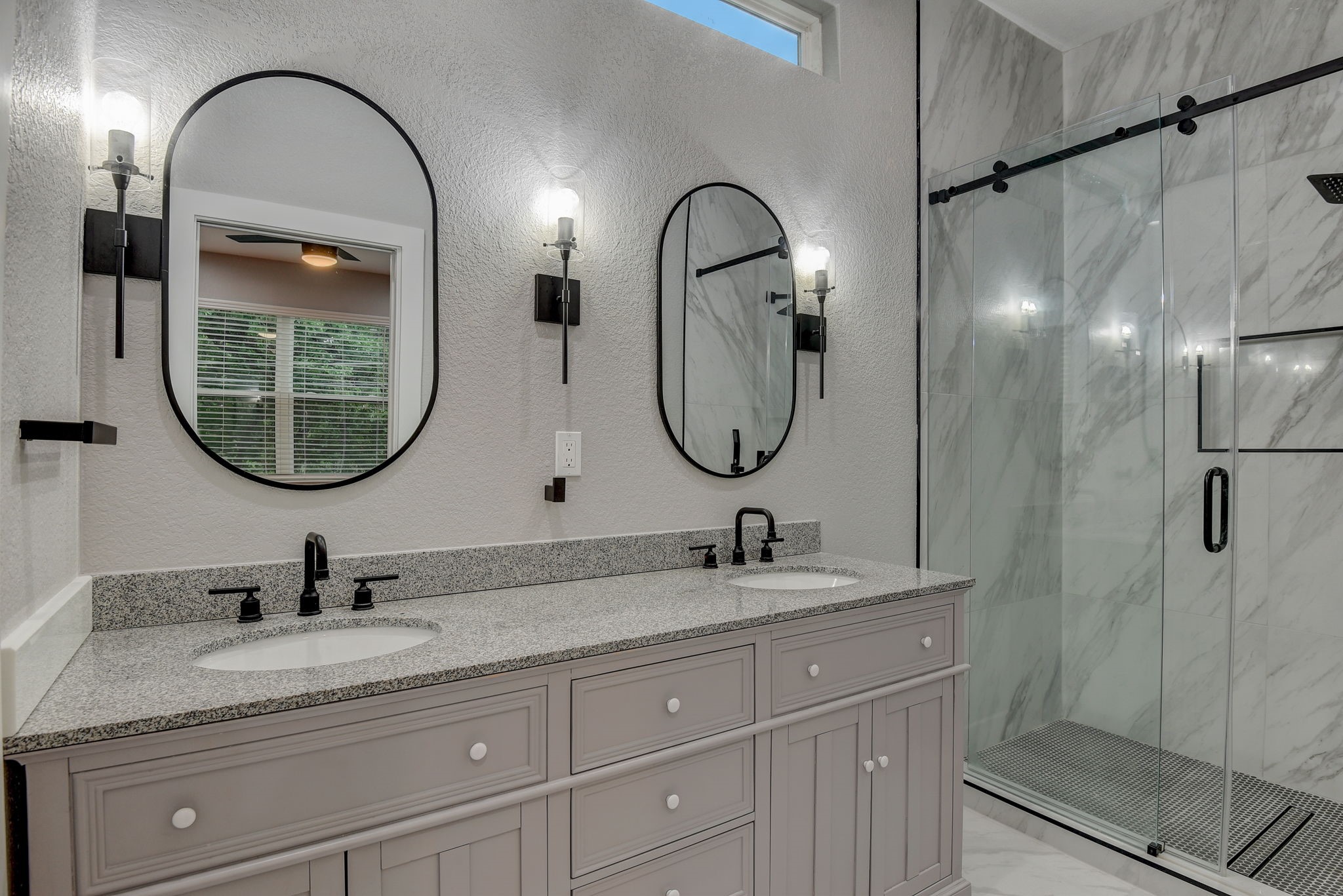 2507 Rogge Lane, Unit 2 Austin, TX 78723 - Photo 4 of 30 a bathroom with a granite countertop double vanity sinks and a mirror