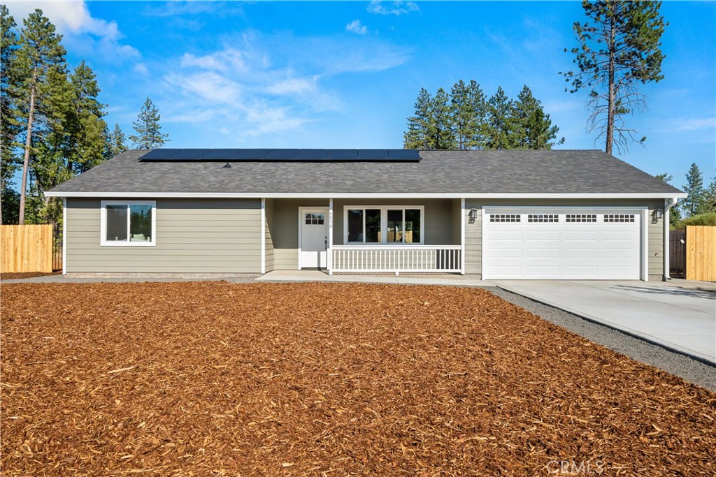 a house with trees in the background