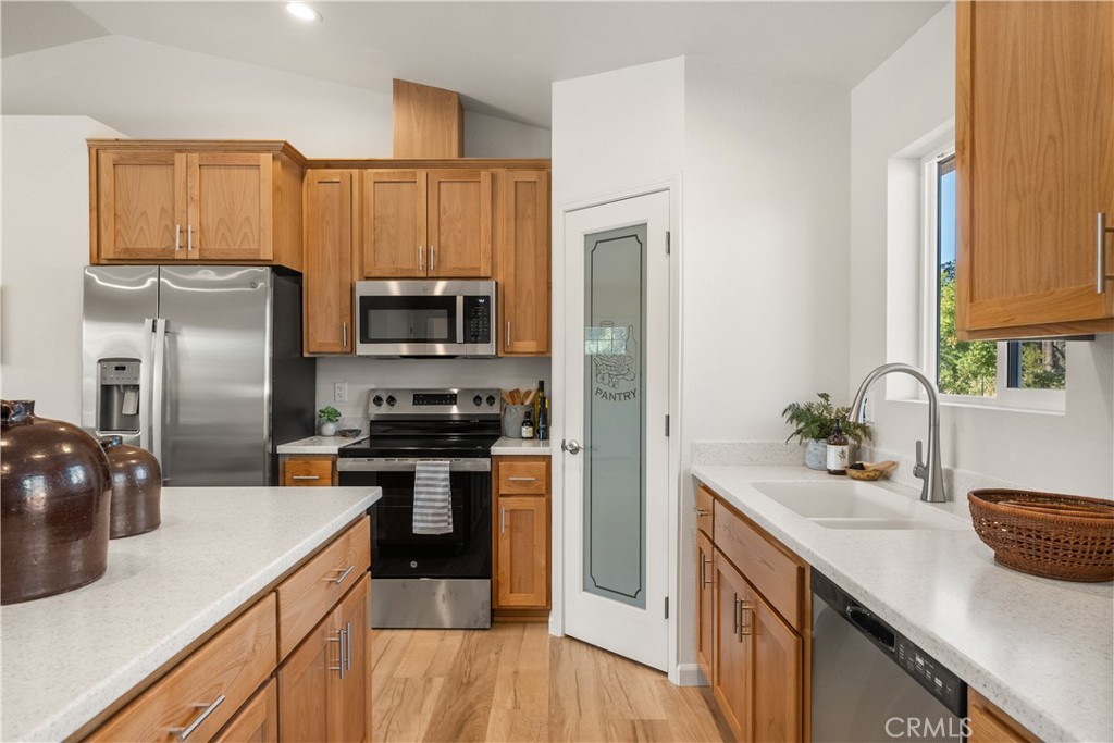 5956 Kibler Road Paradise, CA 95969 - Photo 14 of 36 a kitchen with a sink and refrigerator