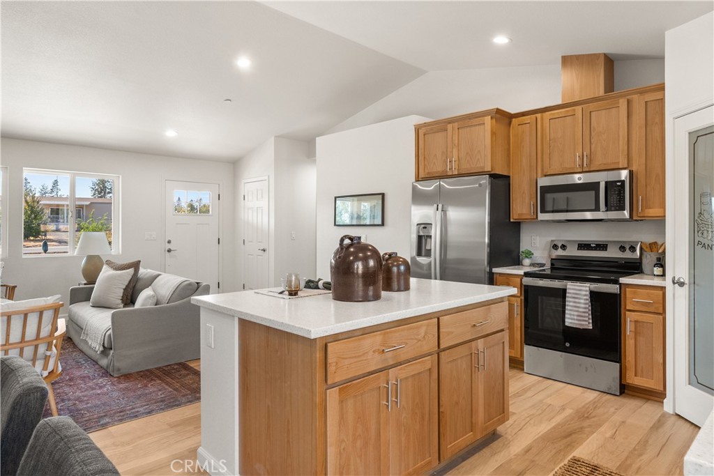 5956 Kibler Road Paradise, CA 95969 - Photo 15 of 36 a kitchen with stainless steel appliances granite countertop a sink stove refrigerator and cabinets