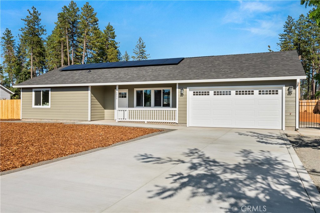5956 Kibler Road Paradise, CA 95969 - Photo 2 of 36 a front view of a house with a dirt road and yard