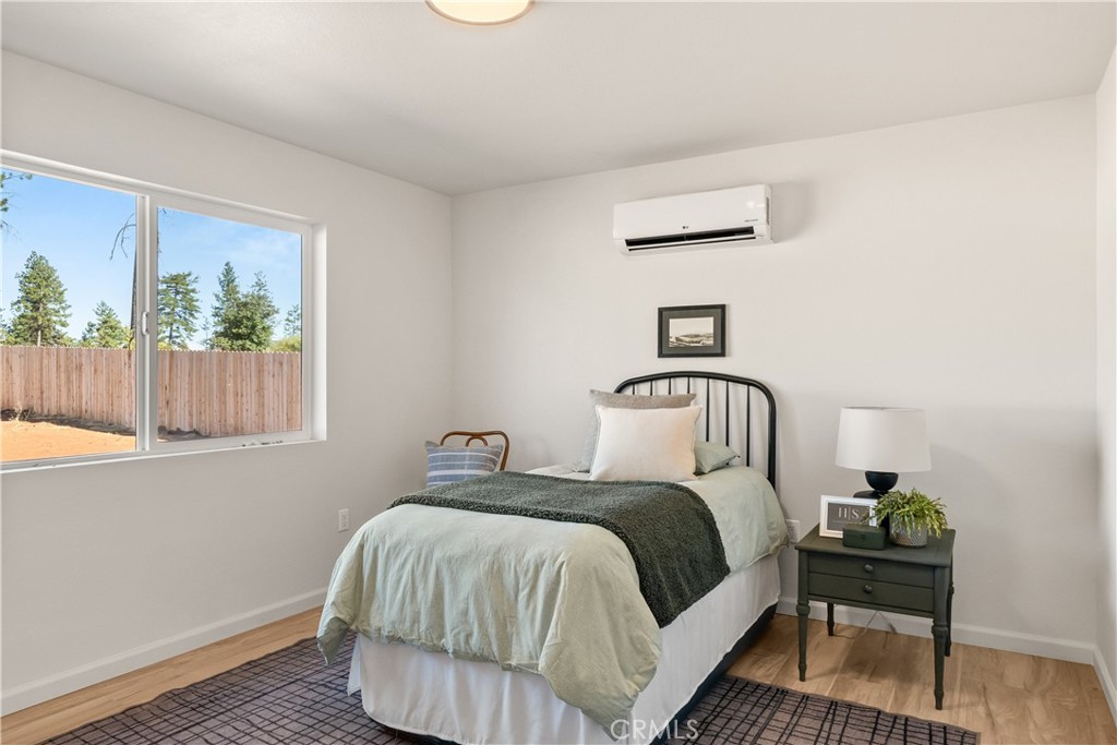 5956 Kibler Road Paradise, CA 95969 - Photo 21 of 36 a bedroom with a bed and a window