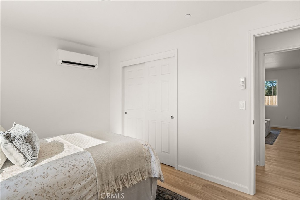 5956 Kibler Road Paradise, CA 95969 - Photo 24 of 36 a bedroom with a bed and wooden floor