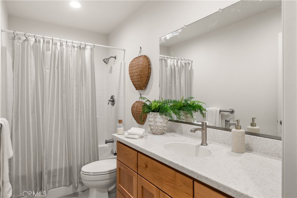 5956 Kibler Road Paradise, CA 95969 - Photo 25 of 36 a bathroom with a granite countertop sink and a mirror