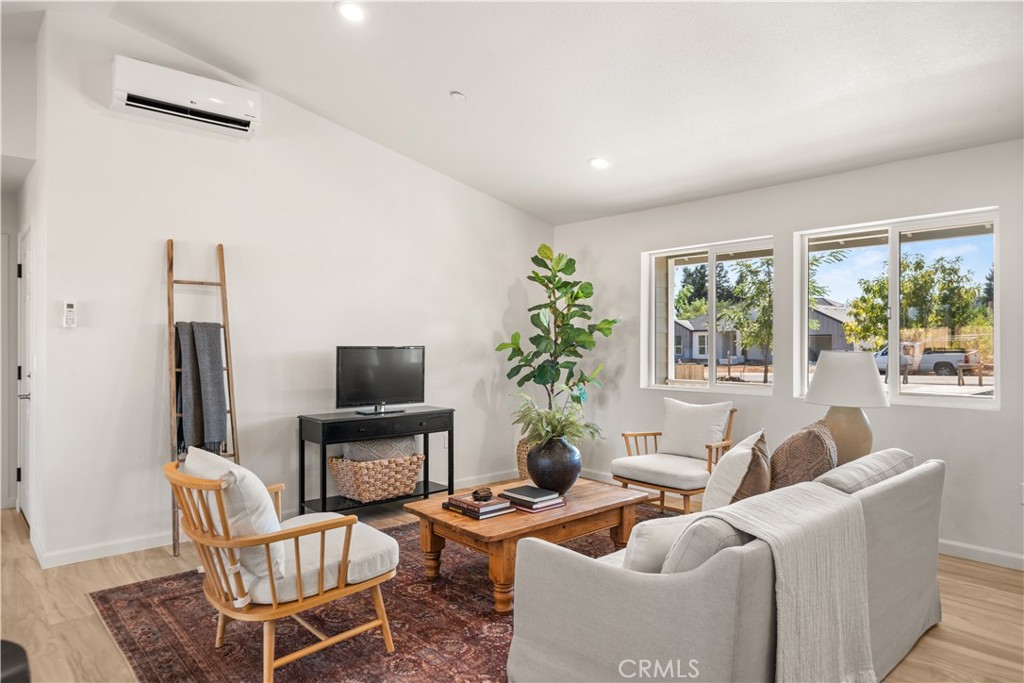5956 Kibler Road Paradise, CA 95969 - Photo 5 of 36 a living room with furniture a large window and a flat screen tv