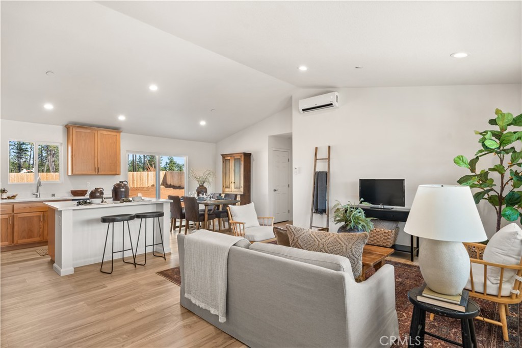 5956 Kibler Road Paradise, CA 95969 - Photo 8 of 36 a living room with furniture a wooden floor and a flat screen tv