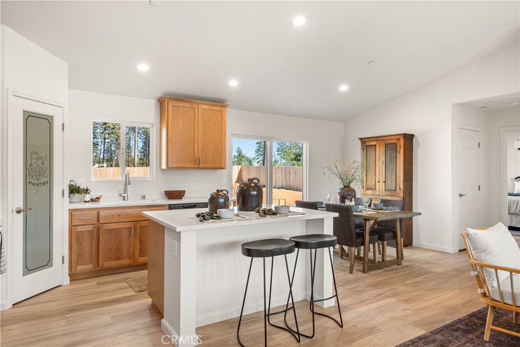 5956 Kibler Road Paradise, CA 95969 - Photo 9 of 36 a kitchen with a table chairs stove and cabinets