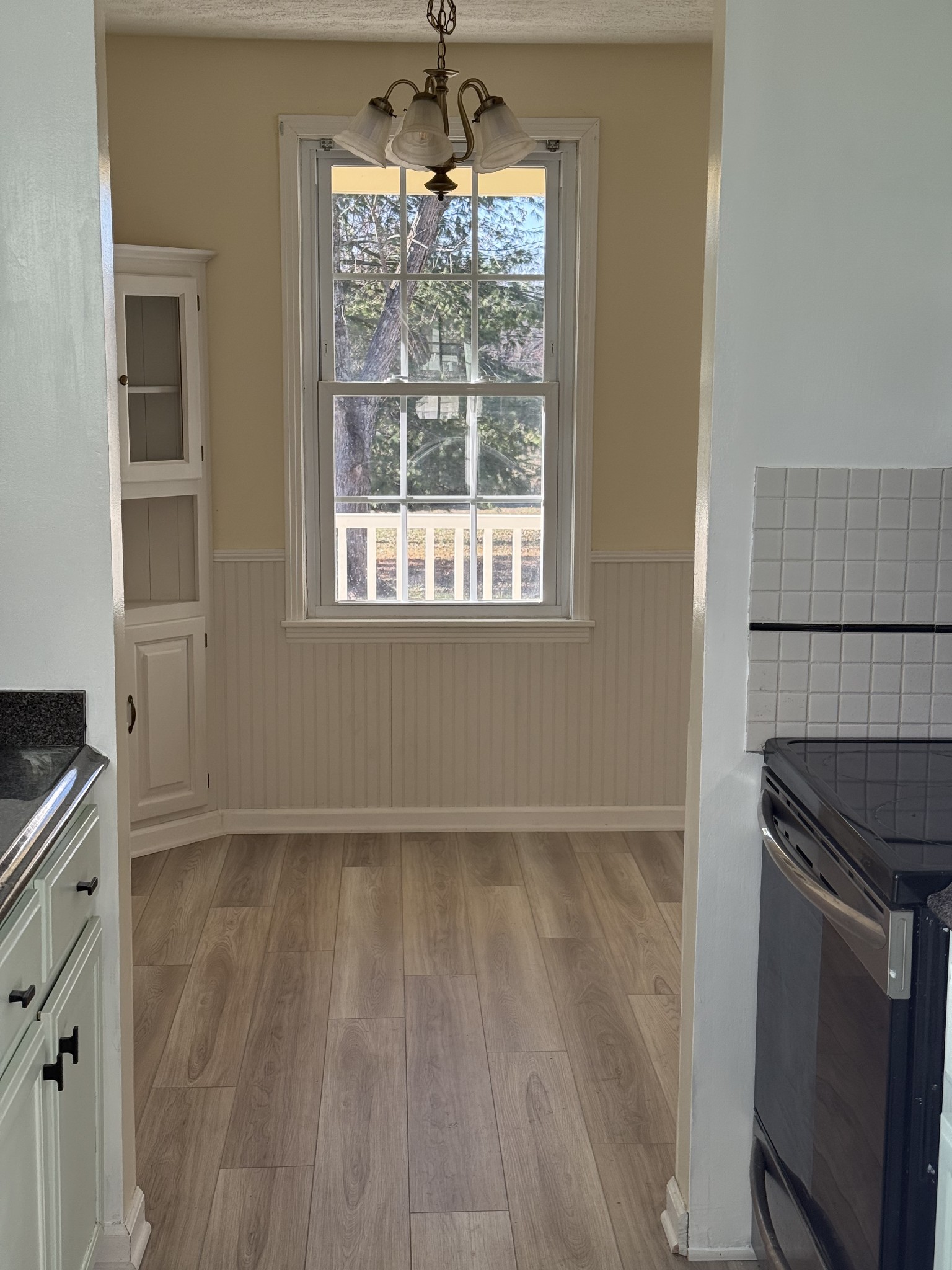 6489 Old Highway 431 South Springfield, TN 37172 - Photo 11 of 21 an empty room with wooden floor cabinet and windows