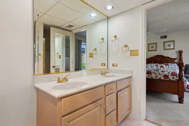 a en suite bathroom with a sink and a mirror