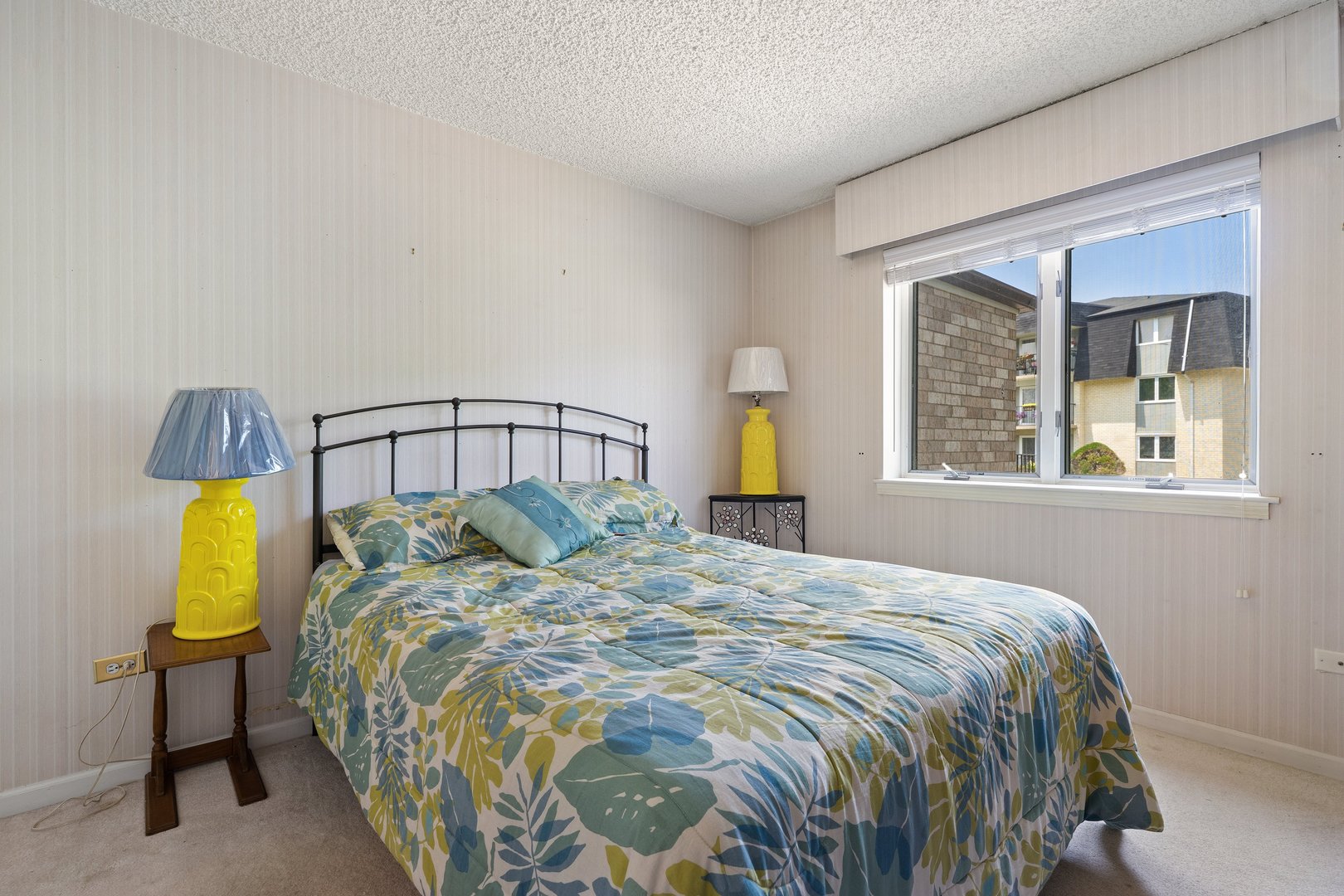 3640 186th Street, Unit 101 Lansing, IL 60438 - Photo 12 of 17 a bedroom with a bed and painting on the wall