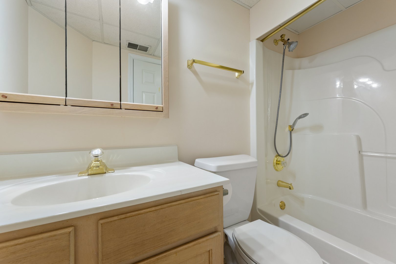 3640 186th Street, Unit 101 Lansing, IL 60438 - Photo 13 of 17 a bathroom with a sink a toilet and shower