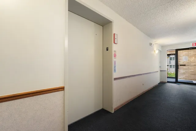 a view of a hallway with closet