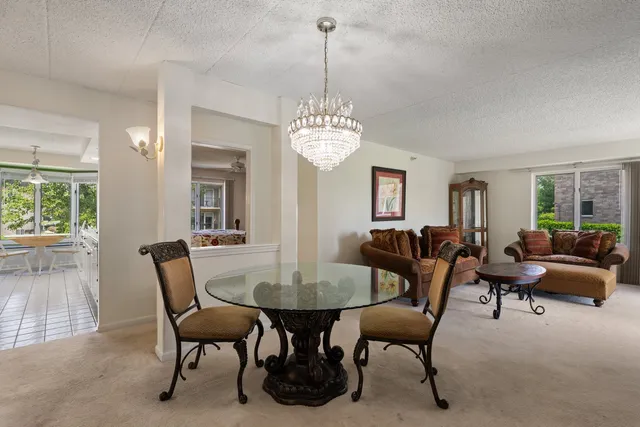 a view of a dining room with furniture and window