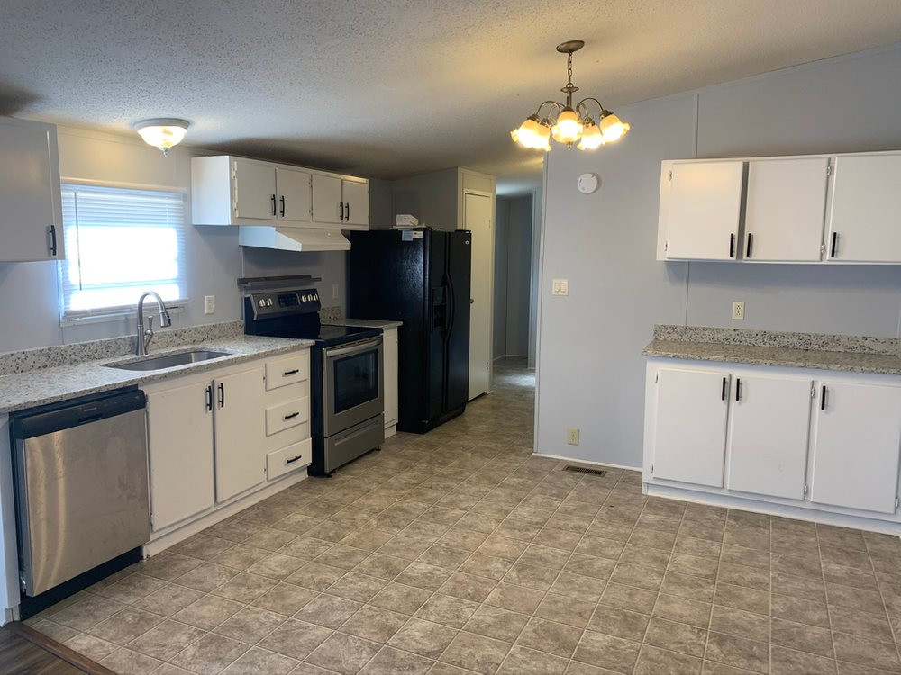 8834 Creek Road Willow Spring, NC 27592 - Photo 9 of 20 Updated kitchen with granite and SS Appliances