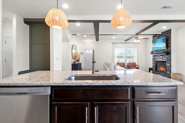 a kitchen with a counter space cabinets and a wooden floor