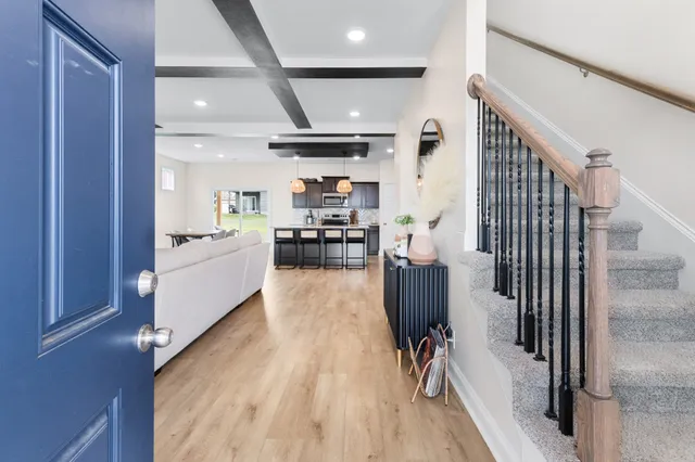 a view of a kitchen with cabinets and wooden floor