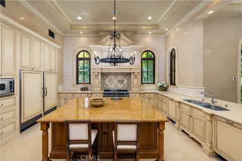 a view of a dining room with furniture wooden floor and a chandelier