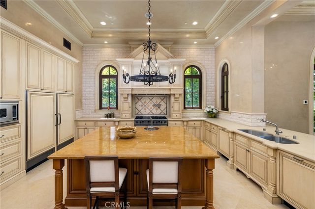 a view of a dining room with furniture wooden floor and a chandelier