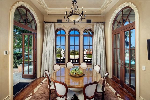 a kitchen that has a lot of cabinets and wooden floor