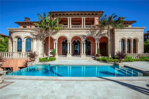 a view of a swimming pool with a table and chairs