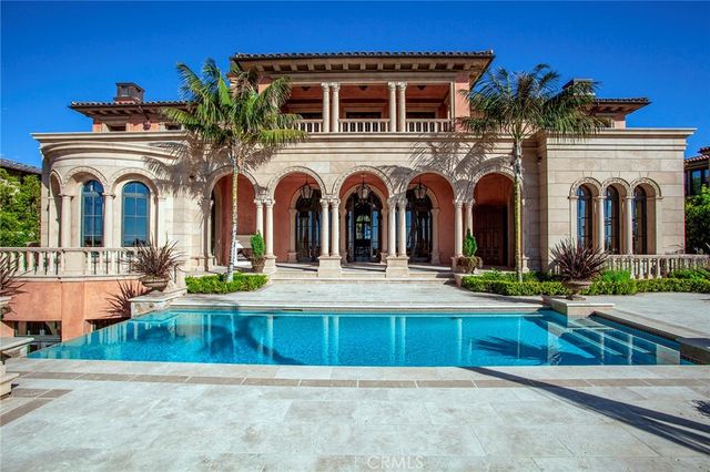 a view of a swimming pool with a table and chairs
