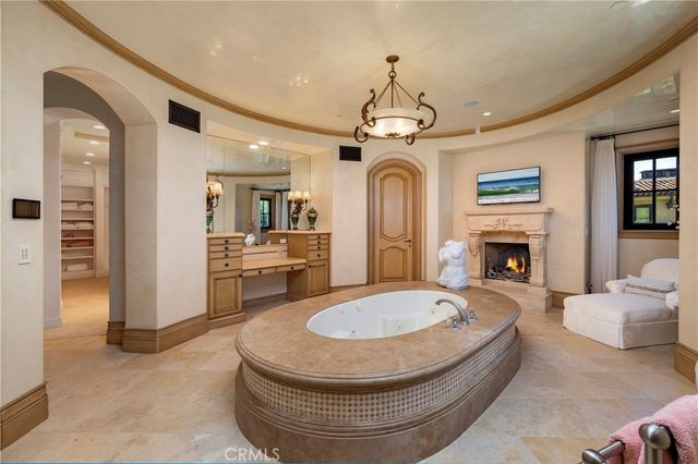 a bathroom with a granite countertop sink mirror and shower